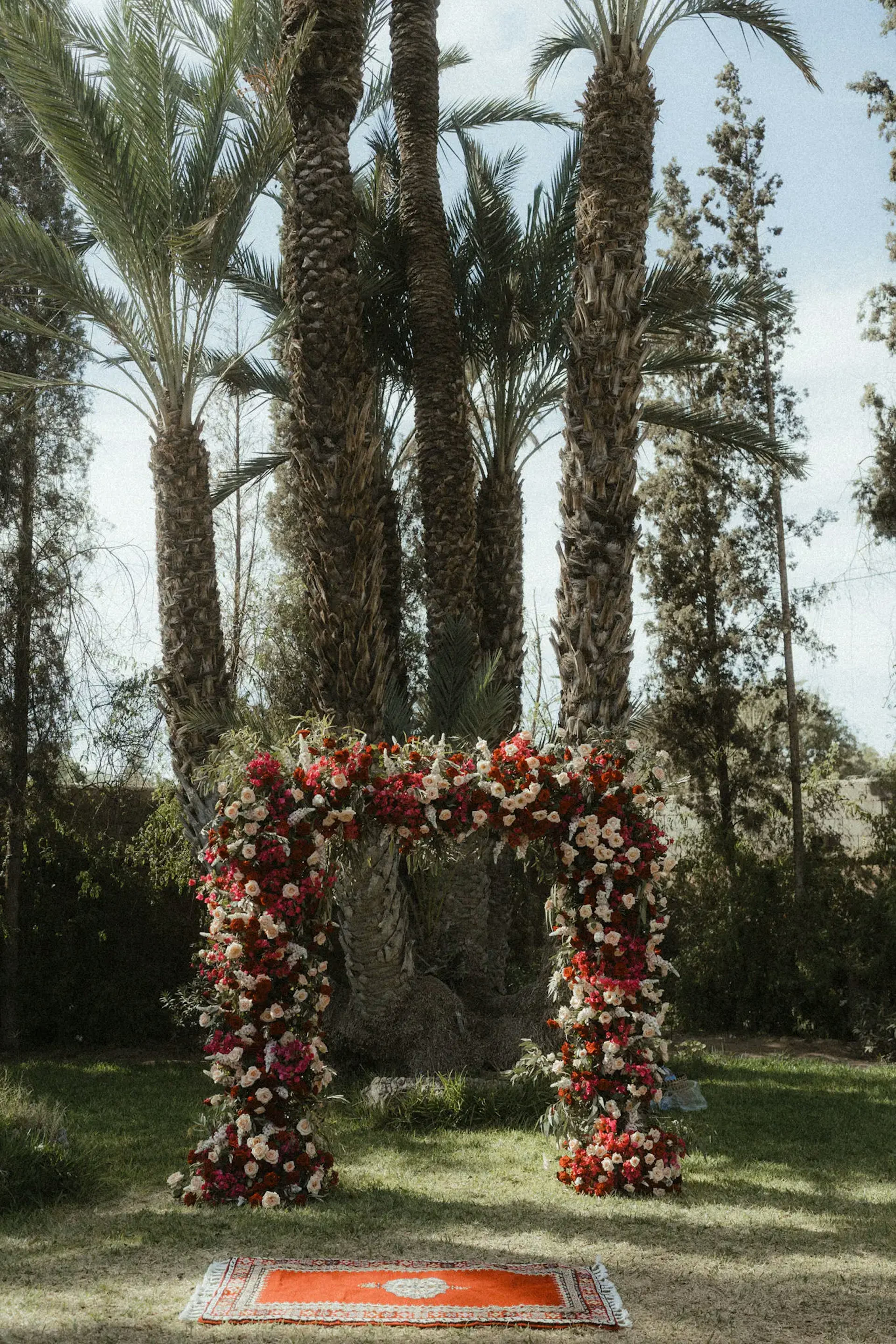 Pink and red flower wedding arch 