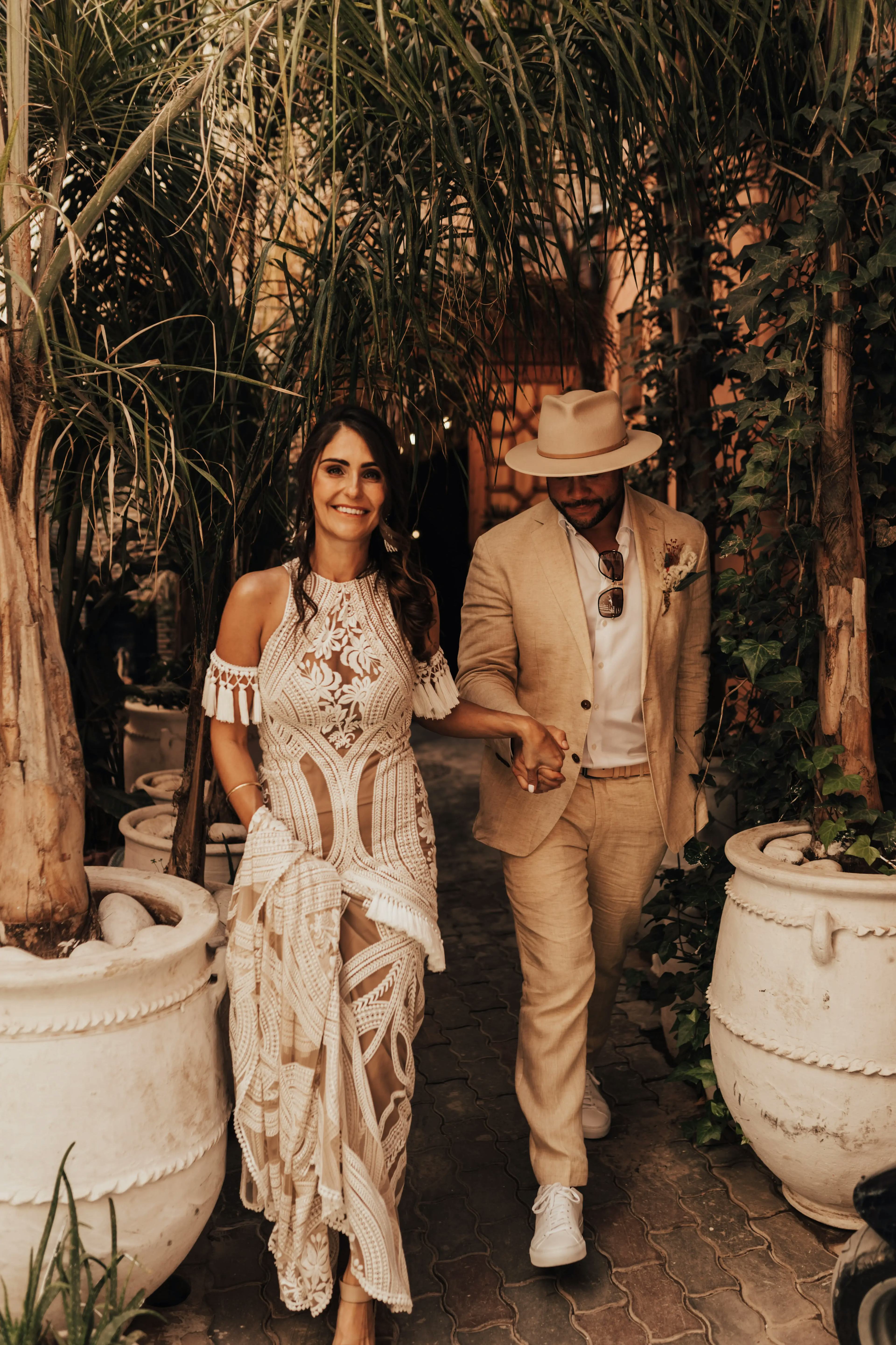 Couple walking through Marrakech wedding venue