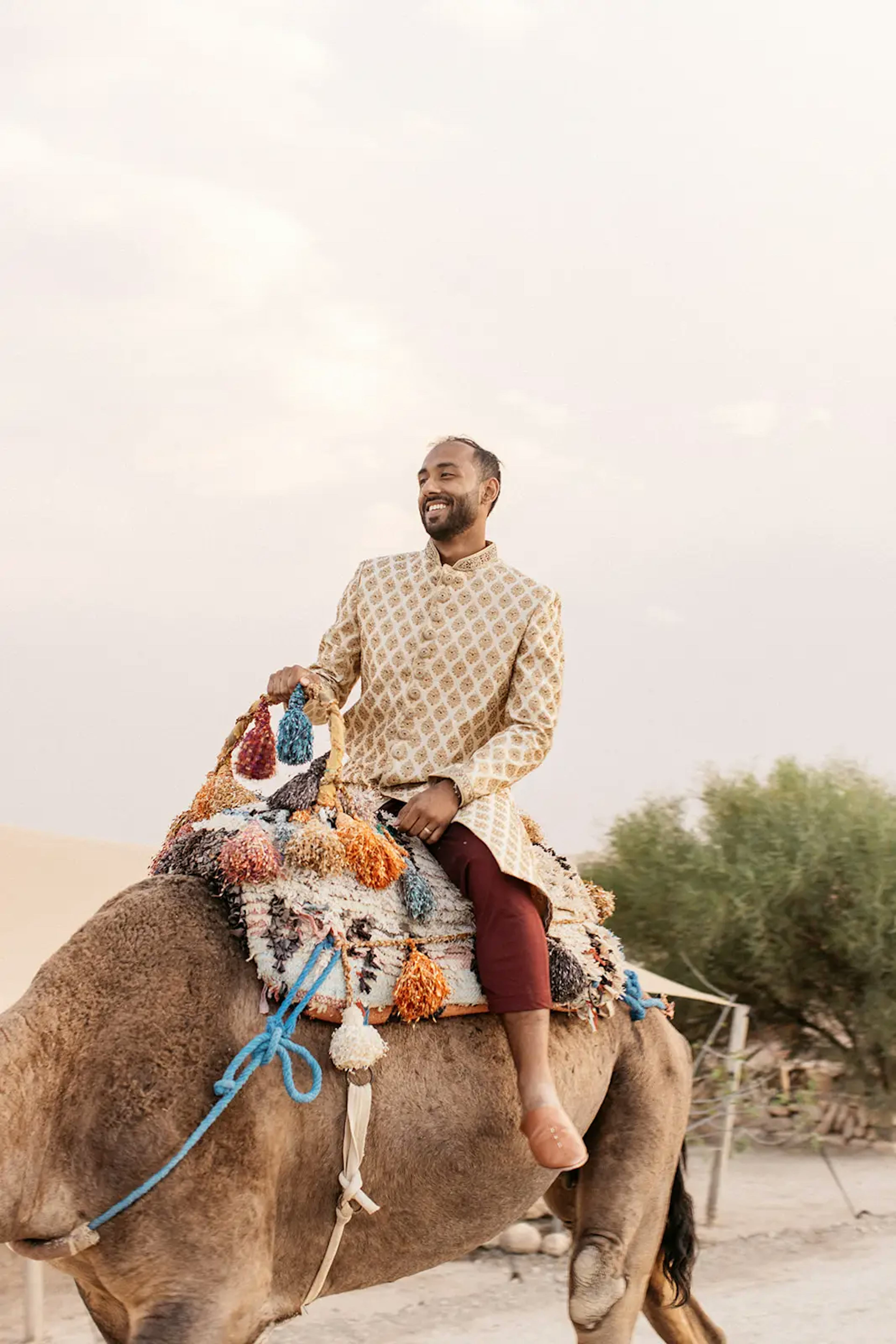 Groom riding a camel in Morocco desert