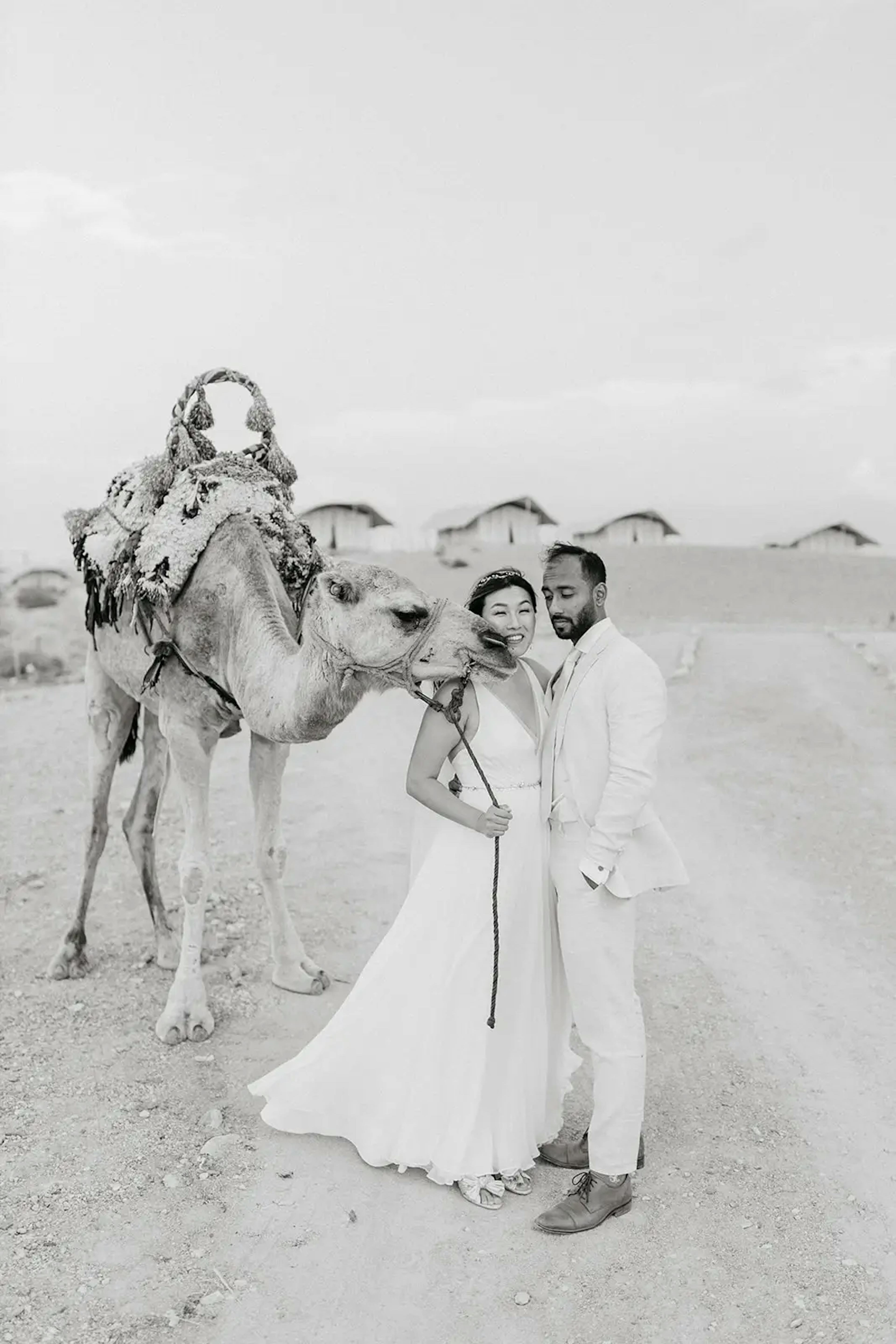 Couple with camel in Moroccan desert