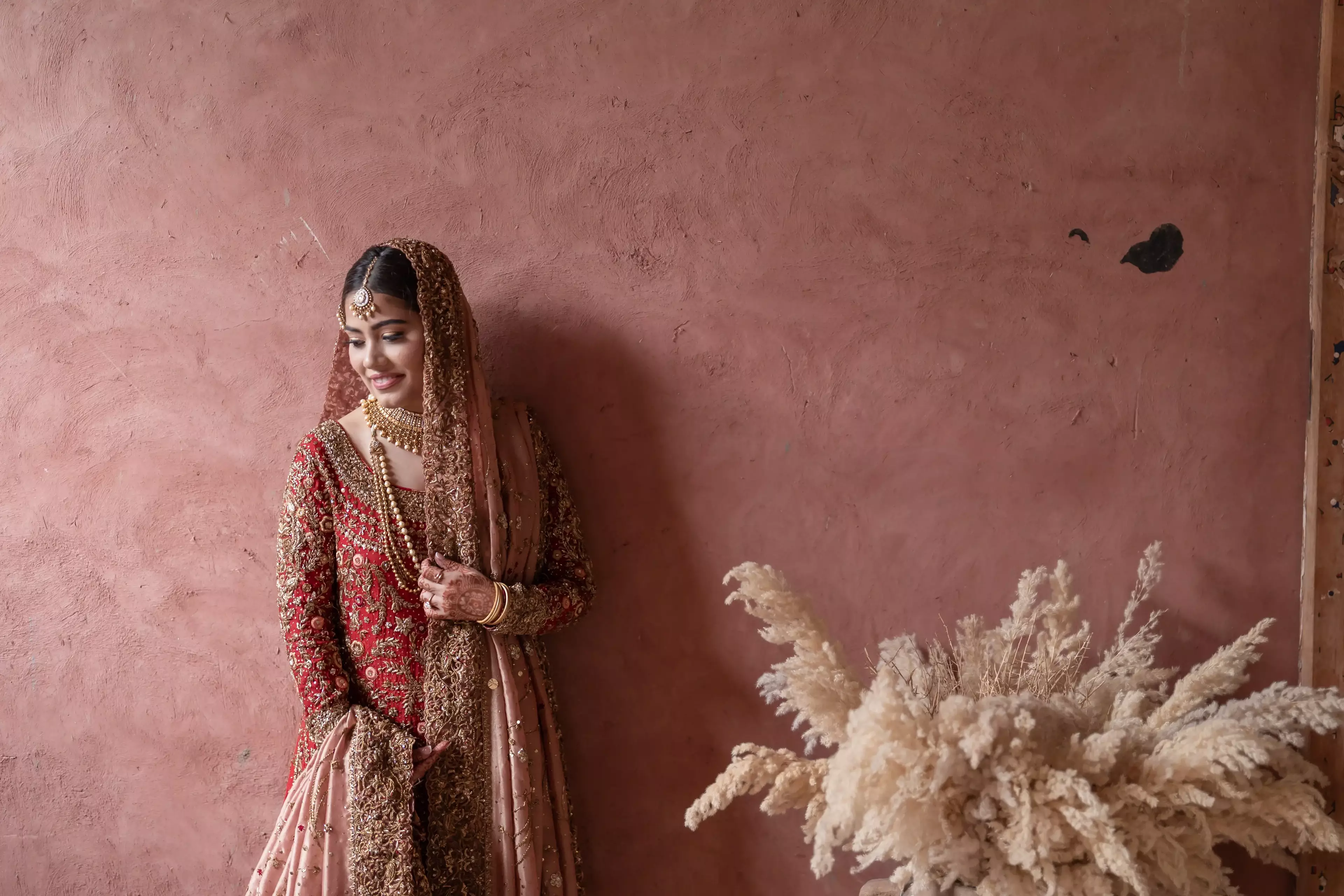 Bride with floral arrangement 