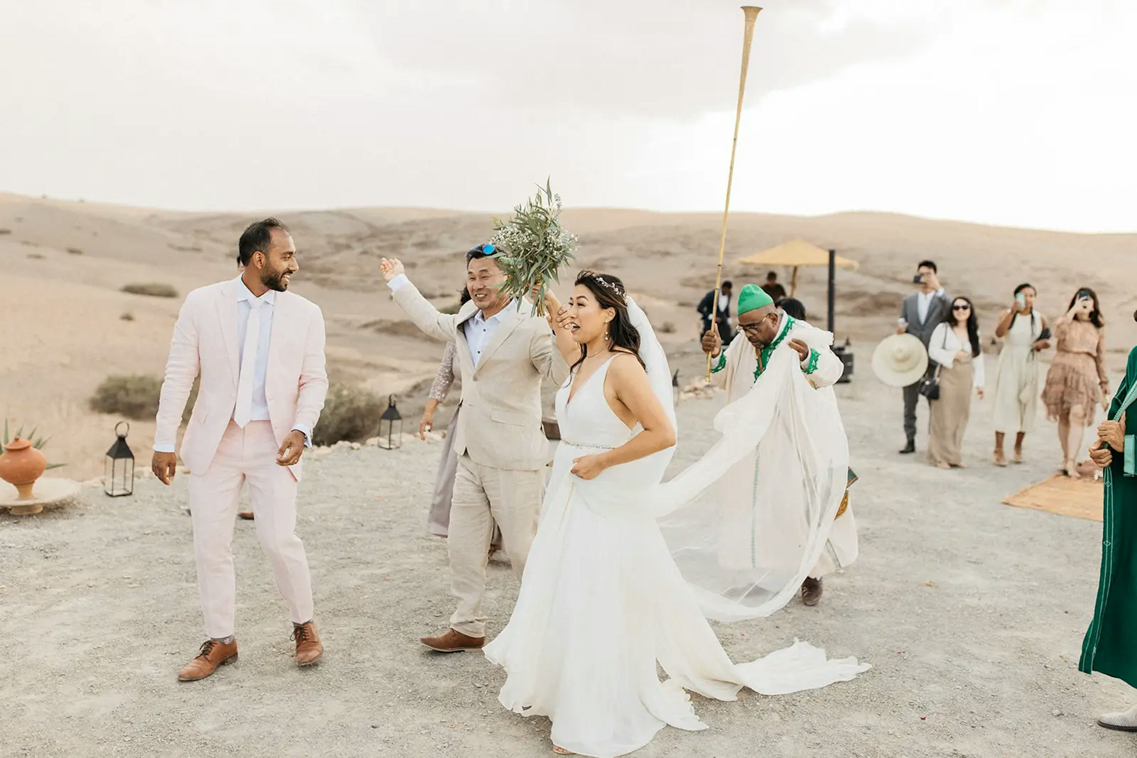 Newlyweds dancing in outdoor wedding in Morocco