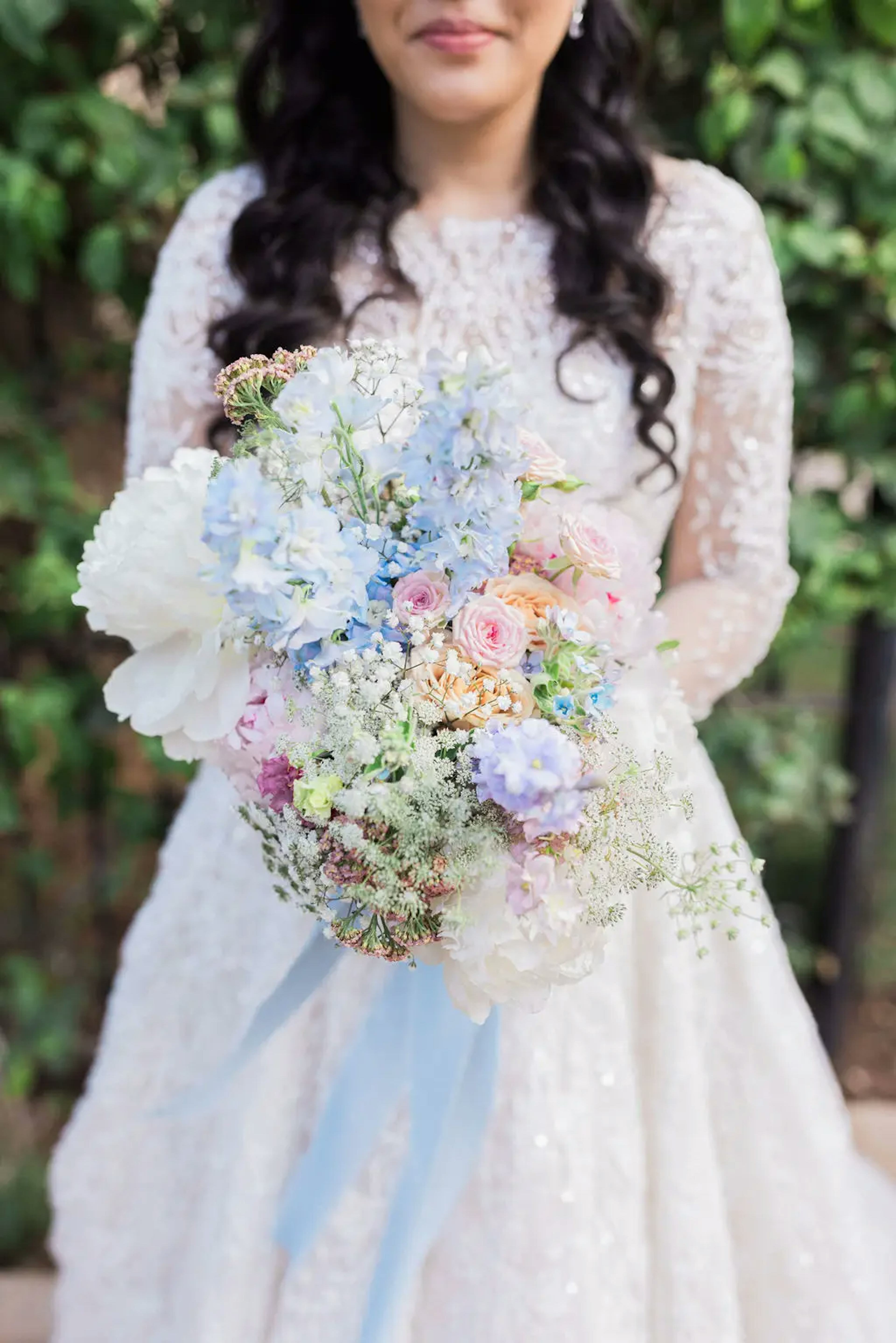 Pastel coloured bridal bouquet. Elegant wedding