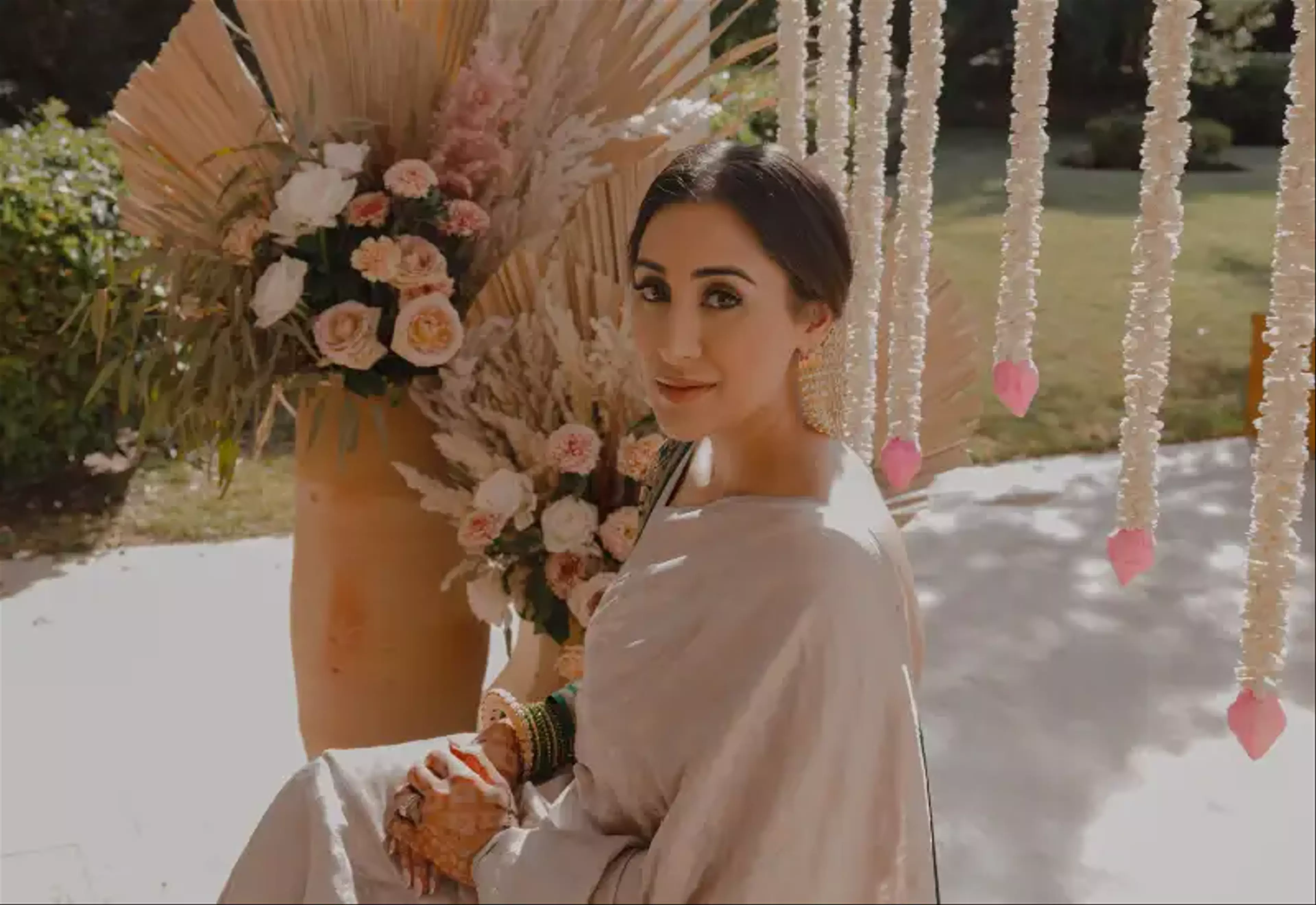 Bride with floral arrangement