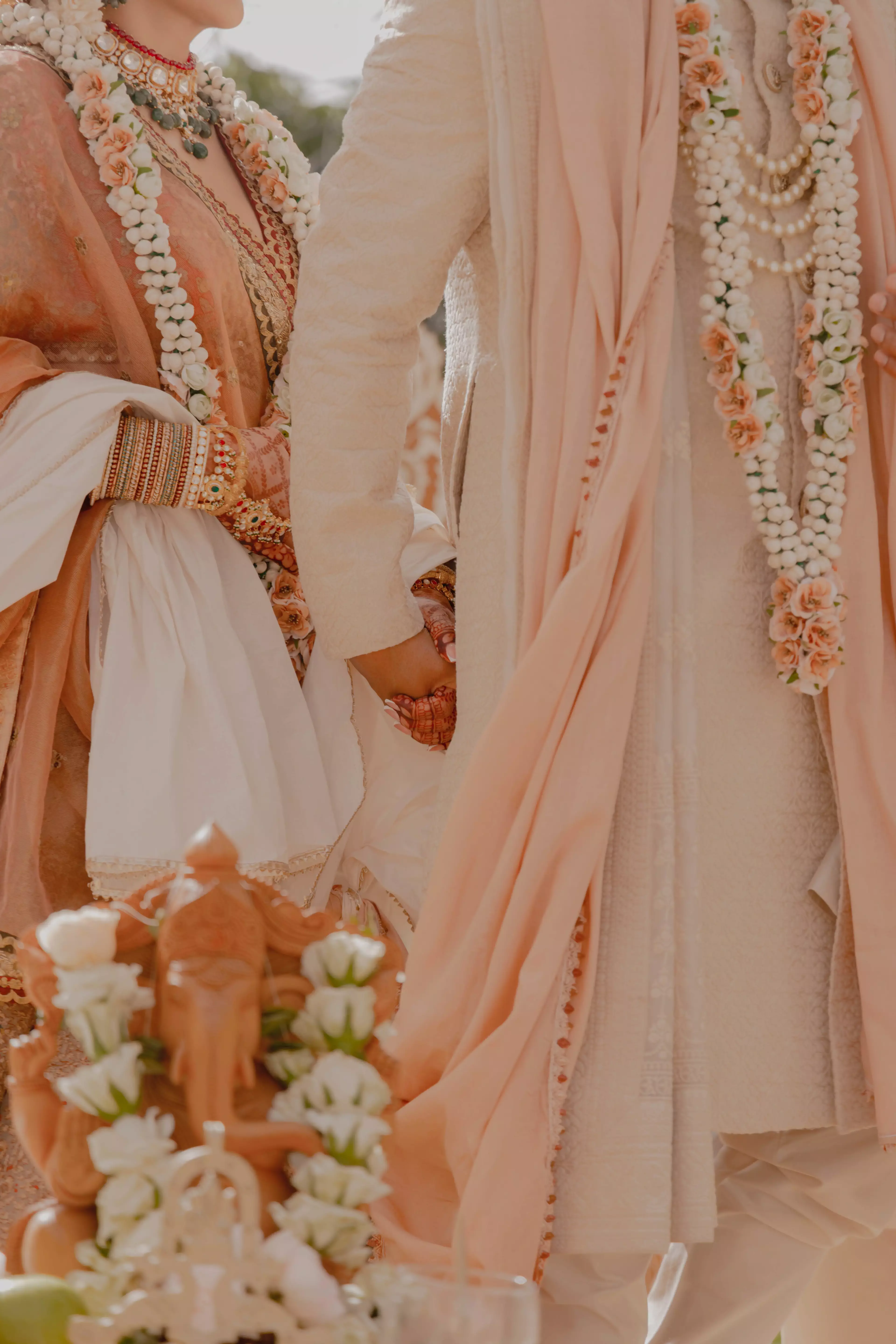 Bride and groom holding hands 