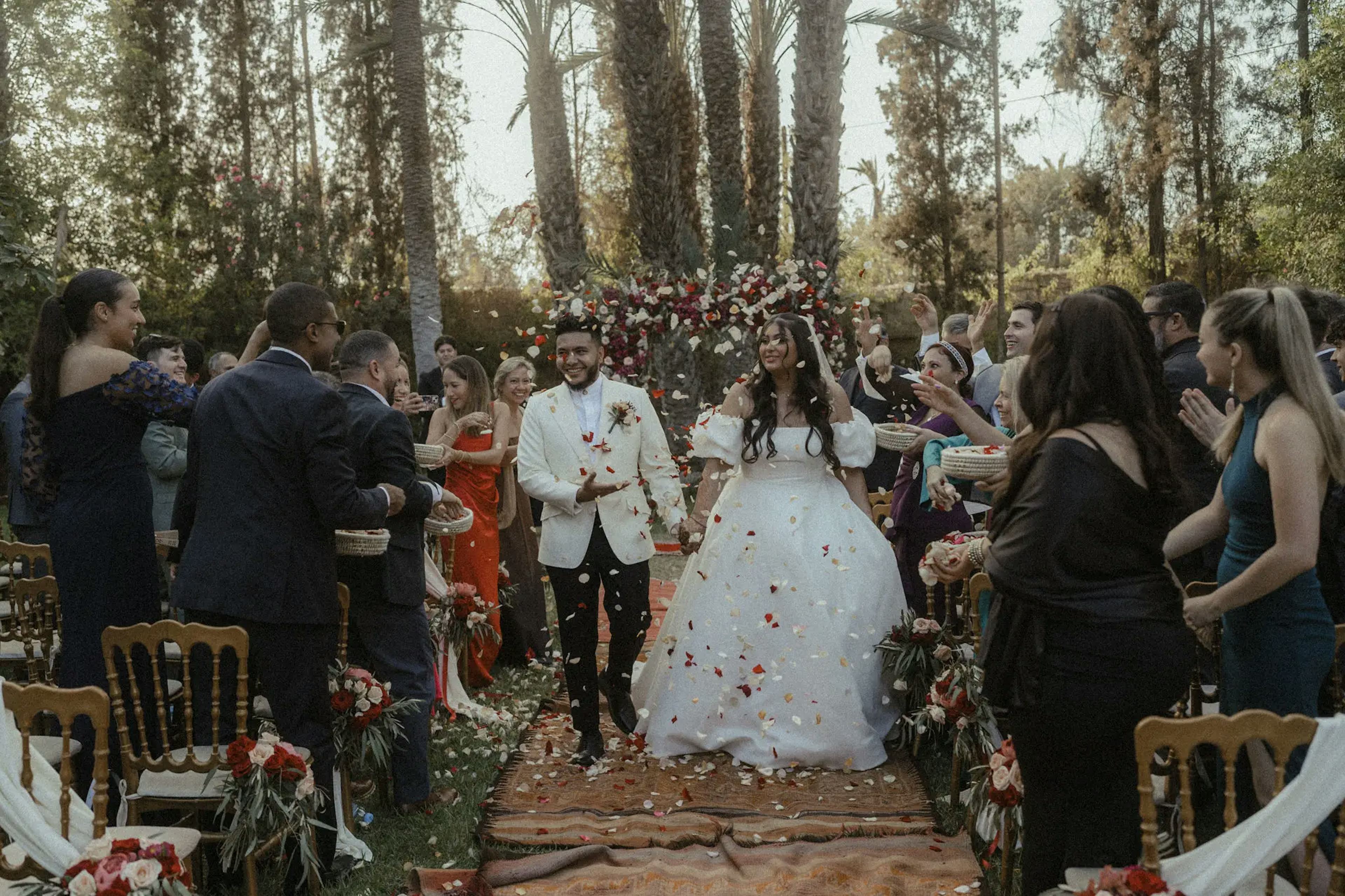 Throwing flower petals on brides