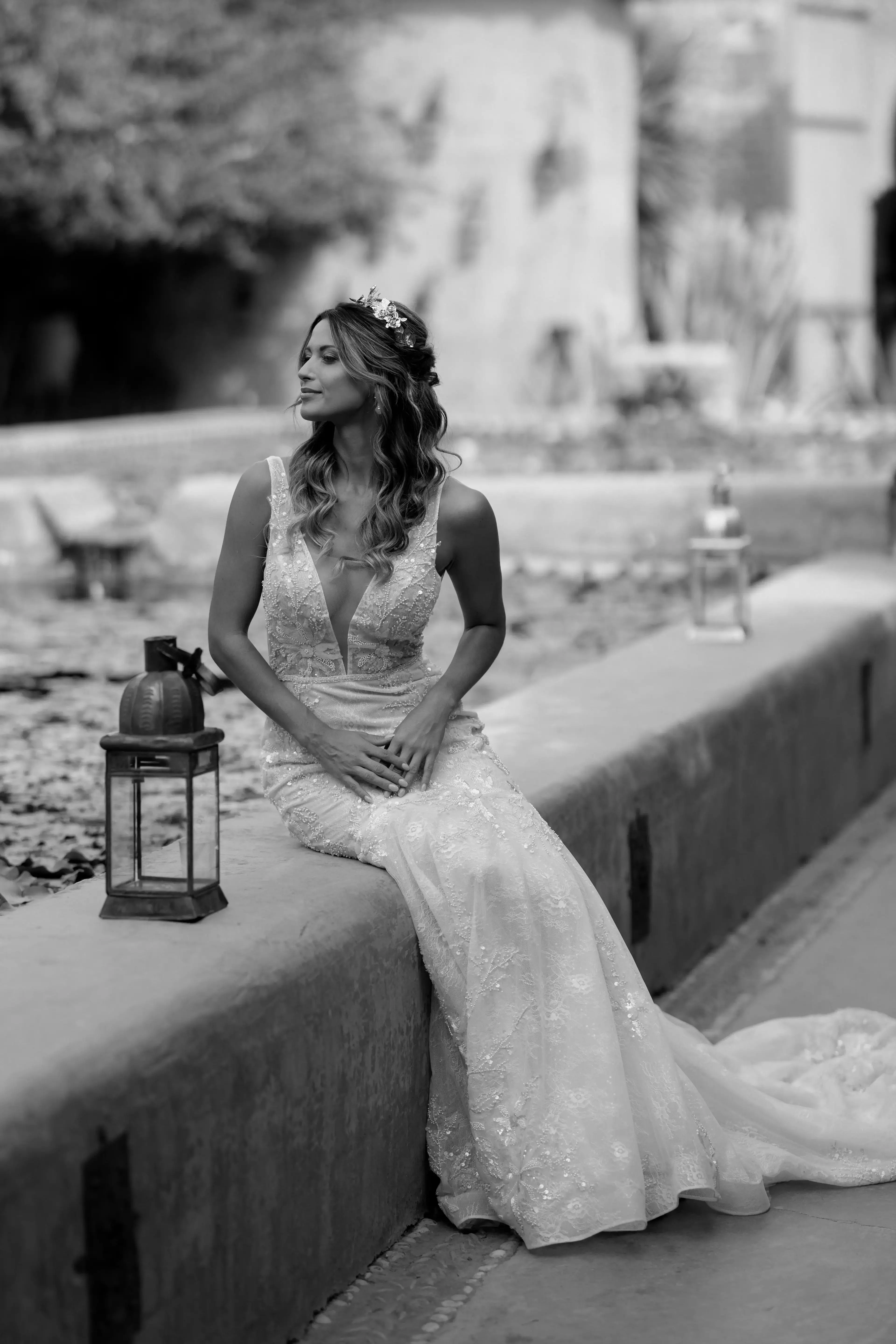 Bride sitting beside lanterns