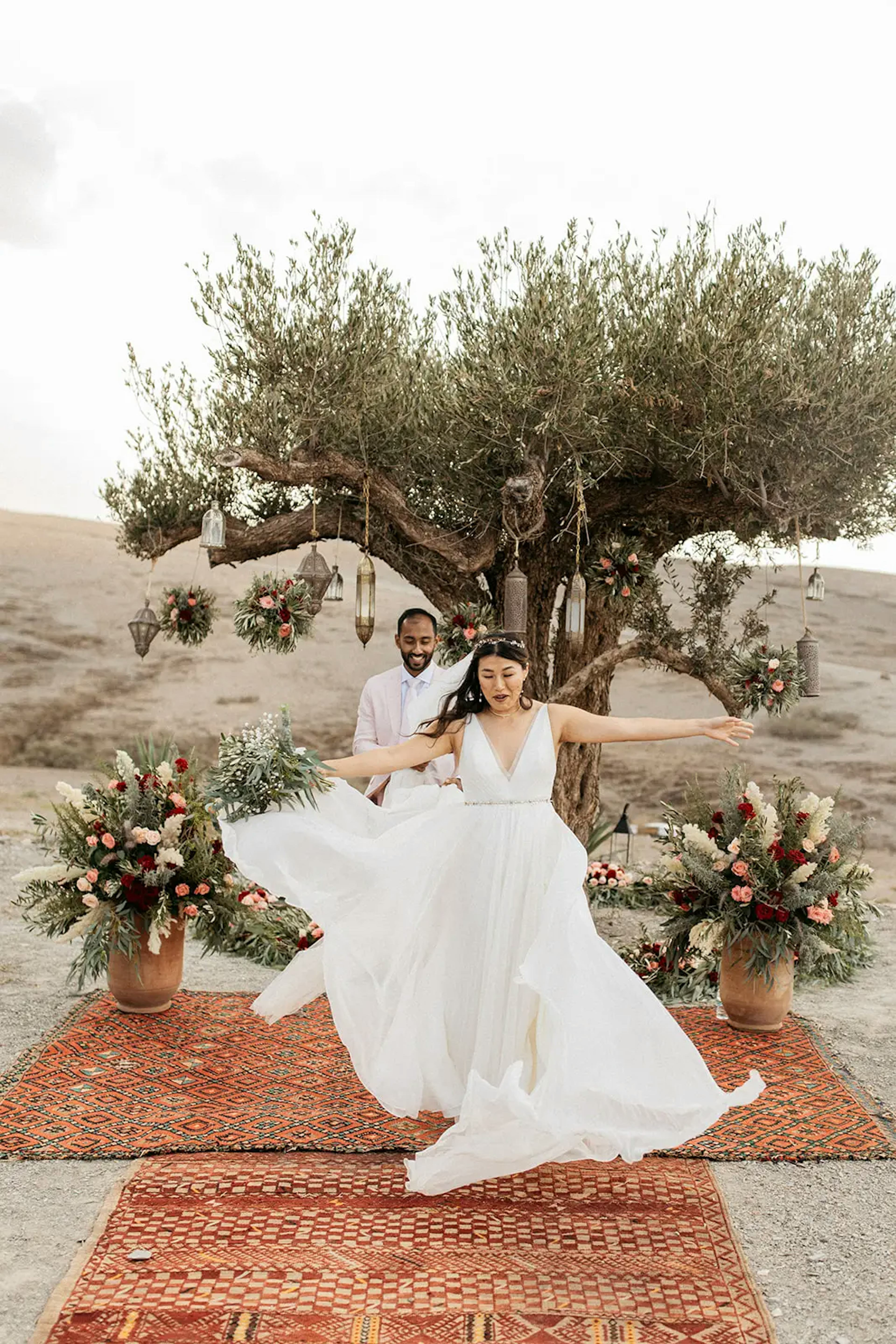 Bride twirling wedding dress in moroccan desert