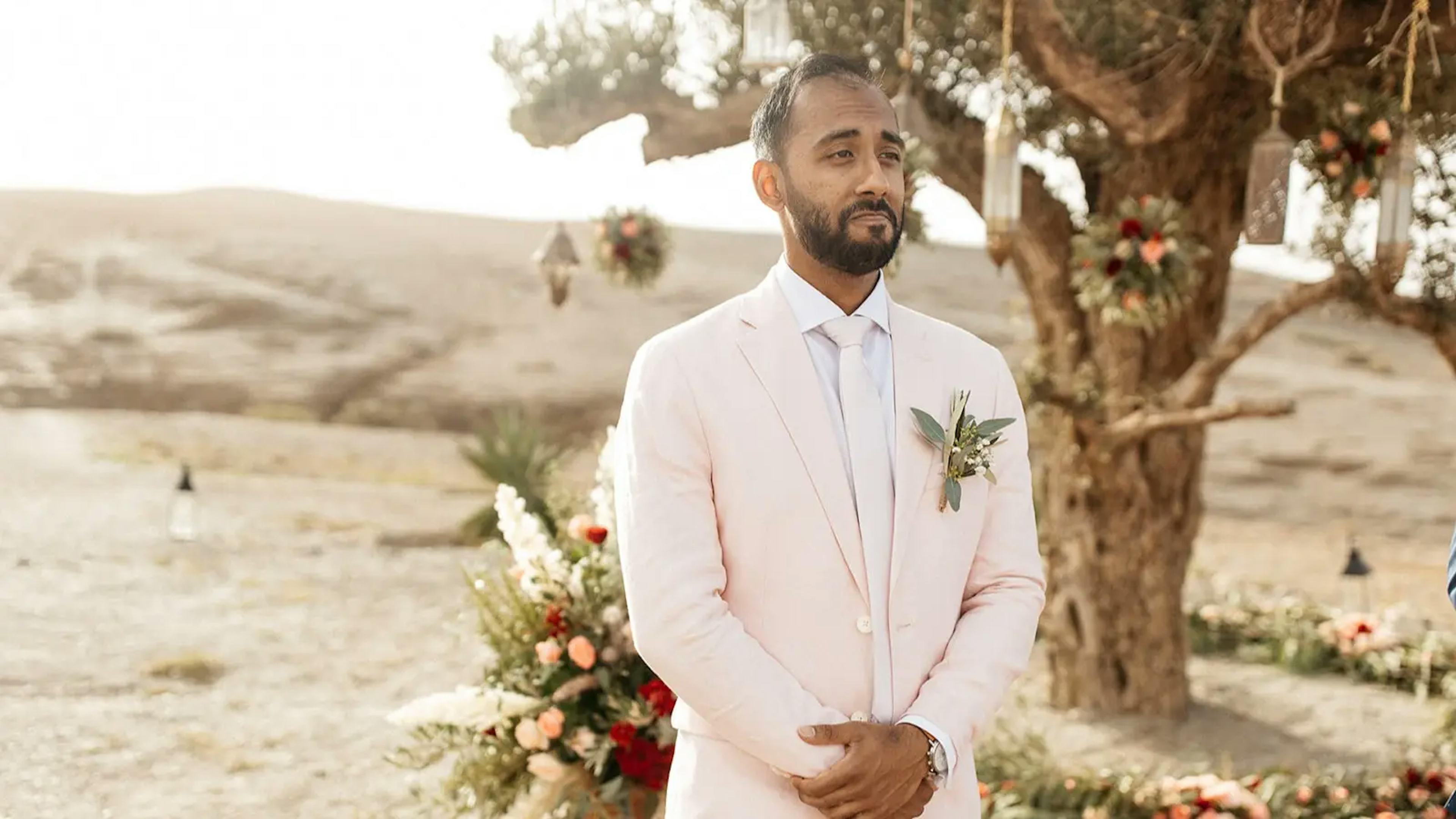 Groom at top of aisle