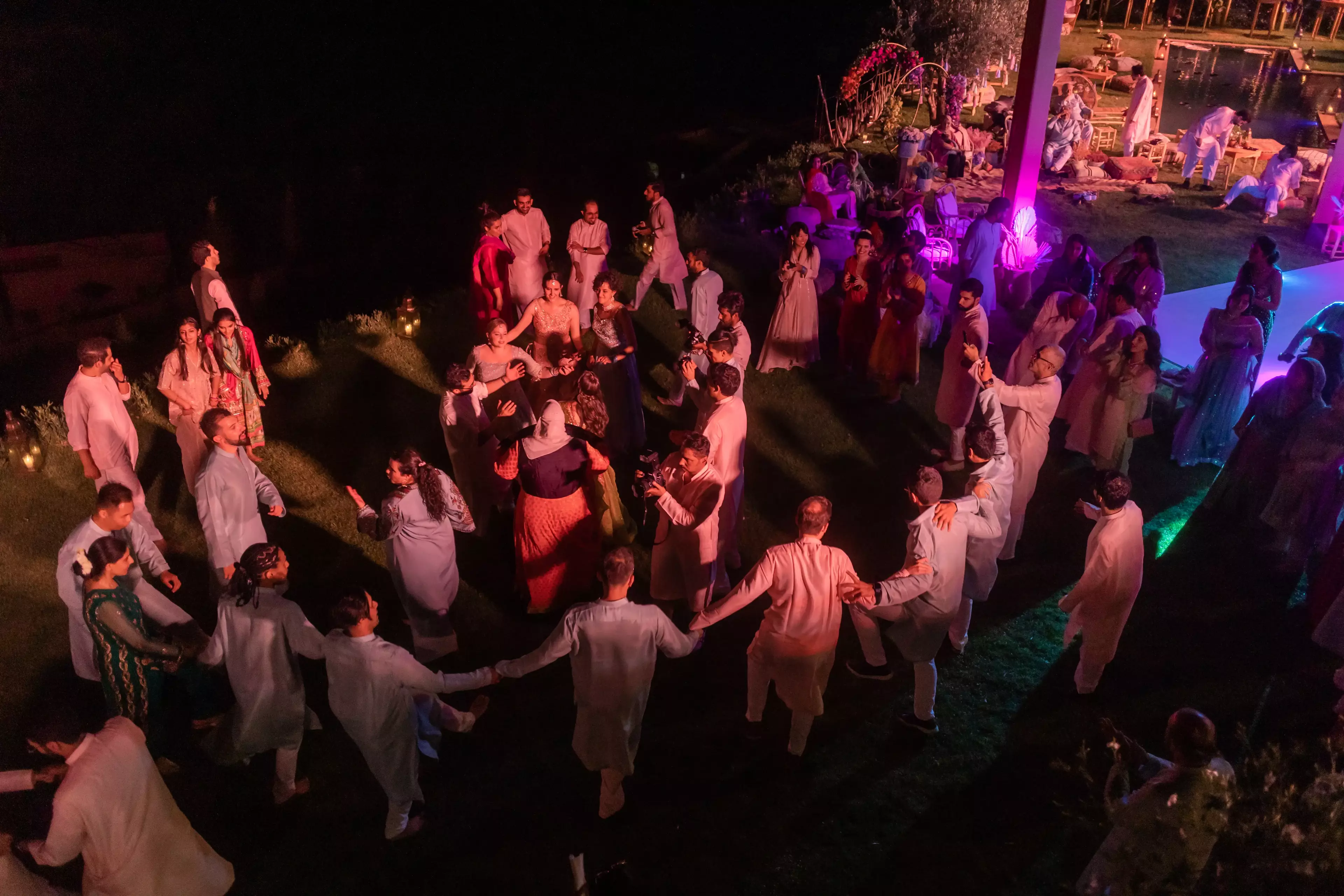 Evening dancing under multi coloured lights