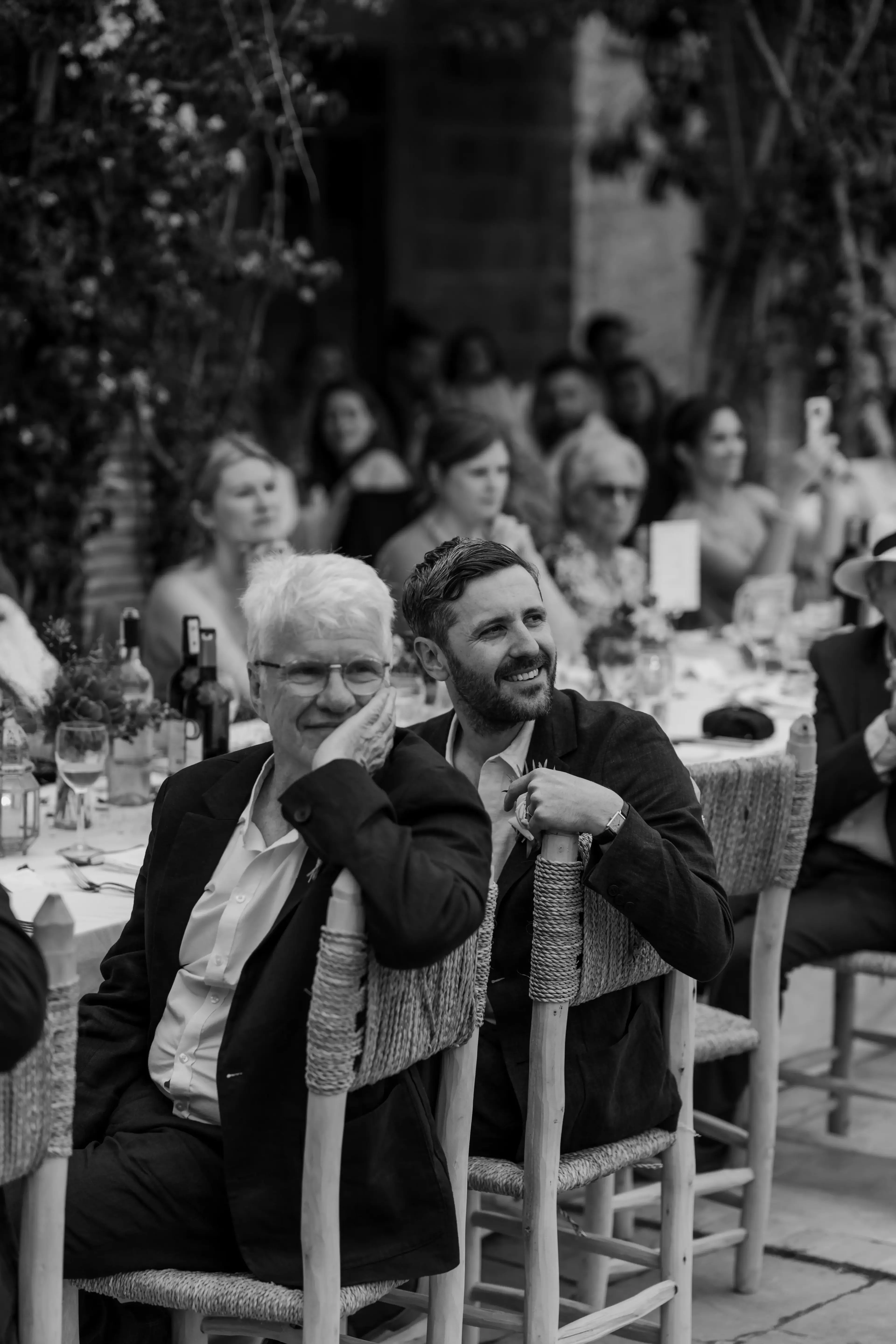 The groom listens during speeches