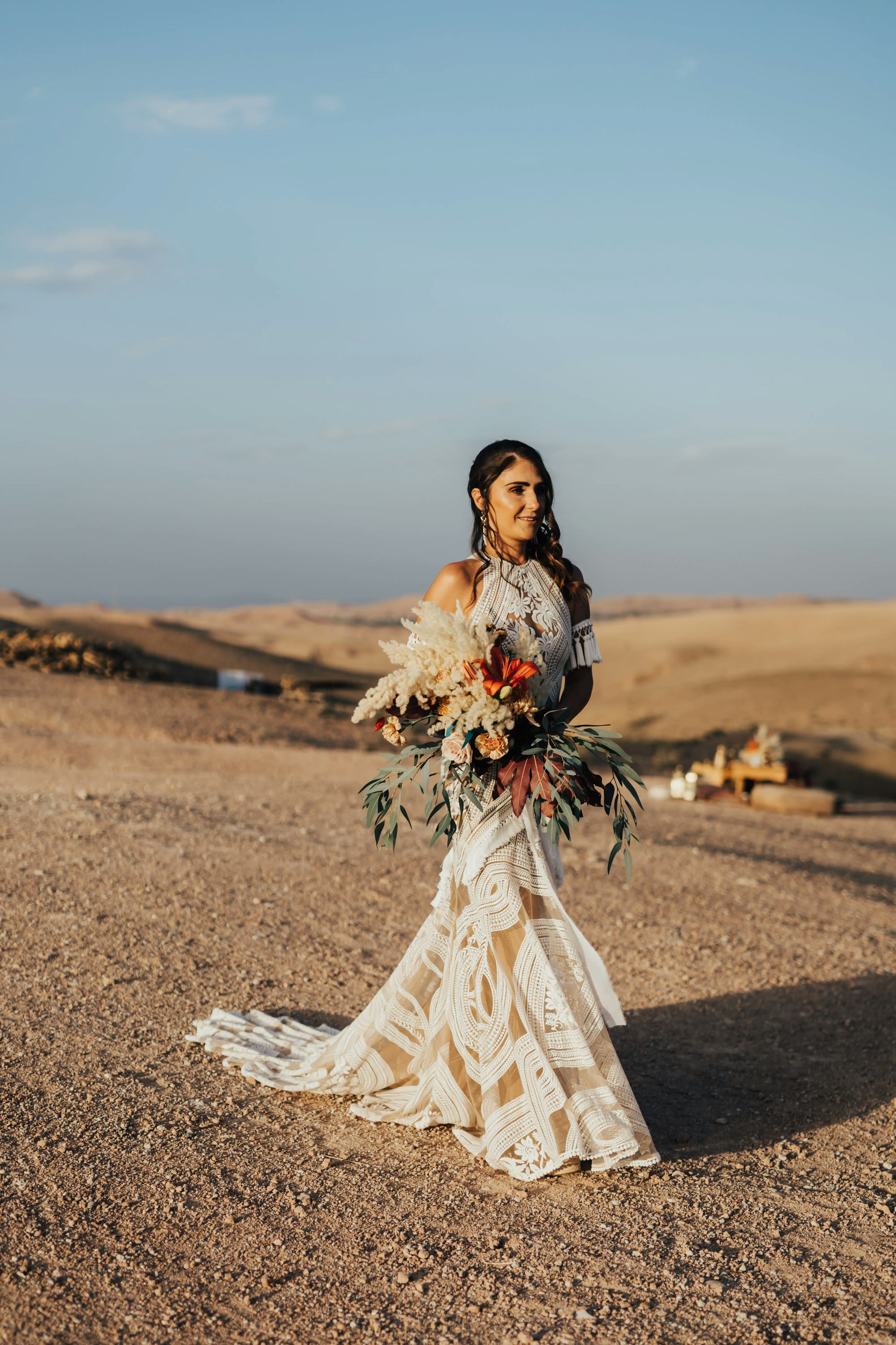 Bride walking to Desert wedding ceremony 