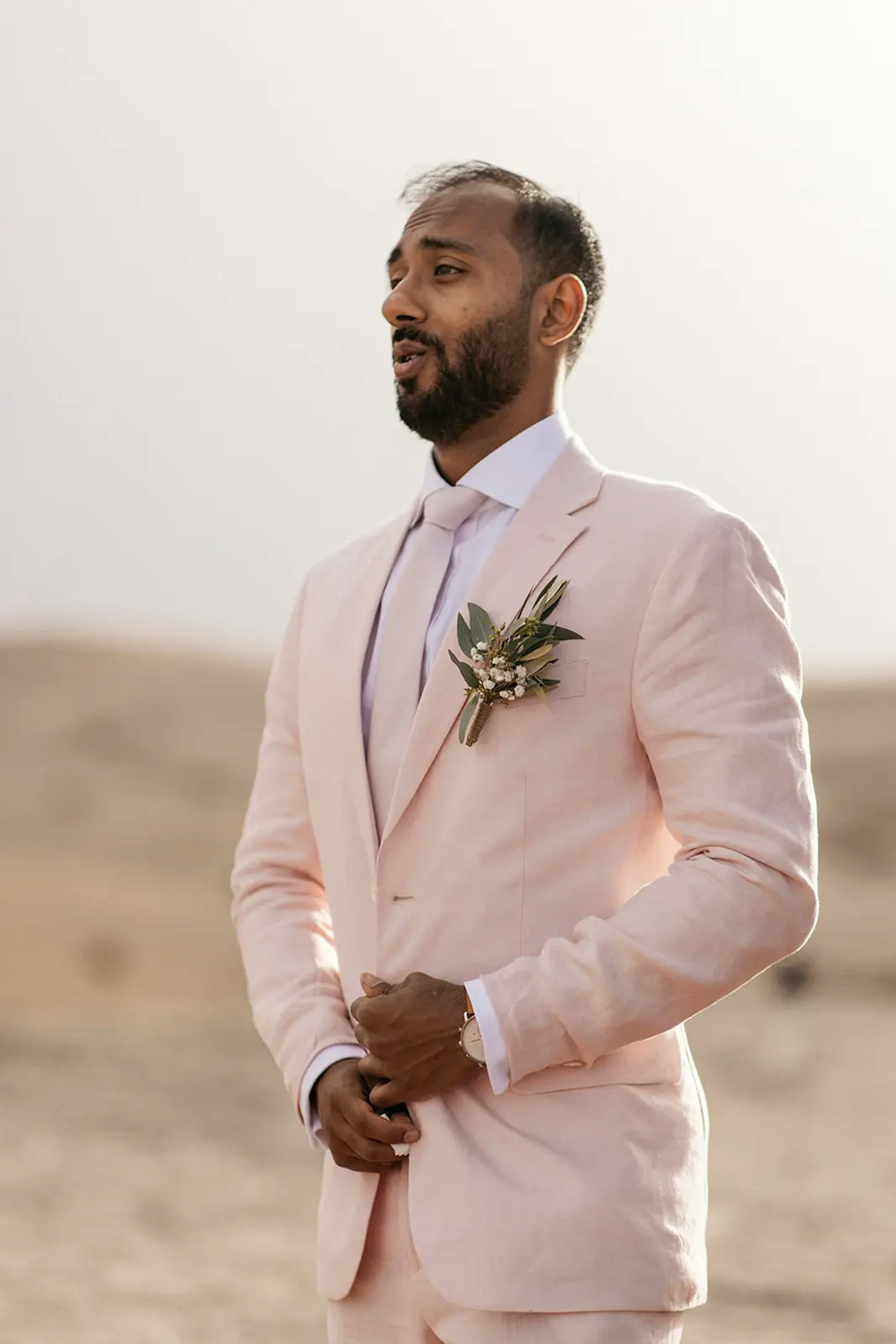 Groom waiting for first look in agafay desert