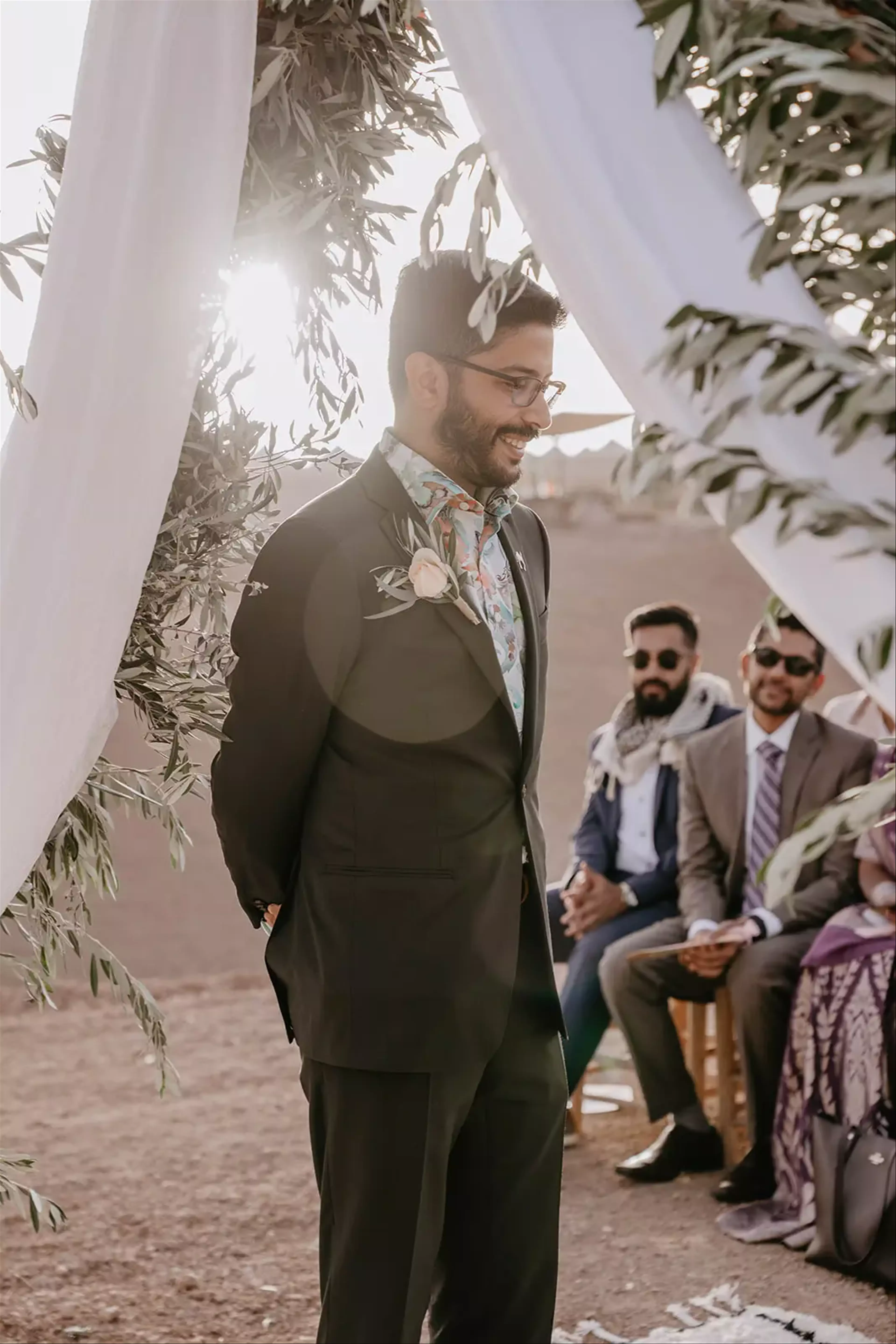 Groom at top of aisle