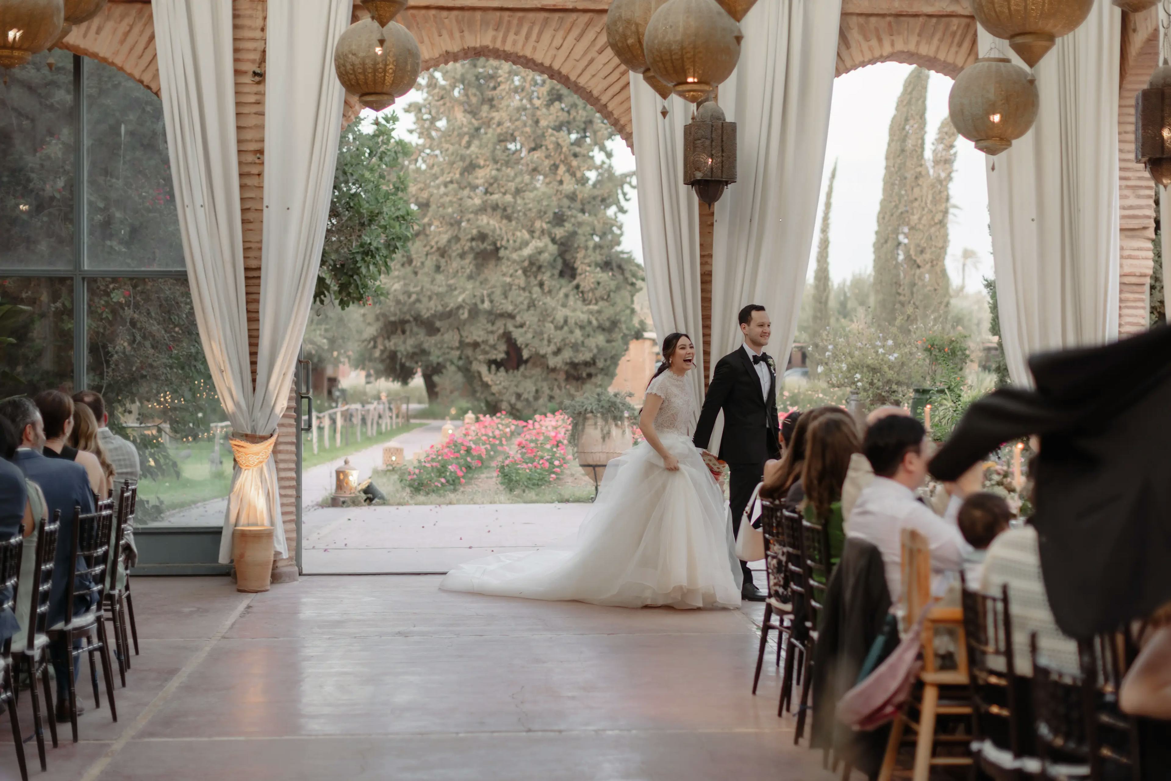 Couple entering wedding reception 