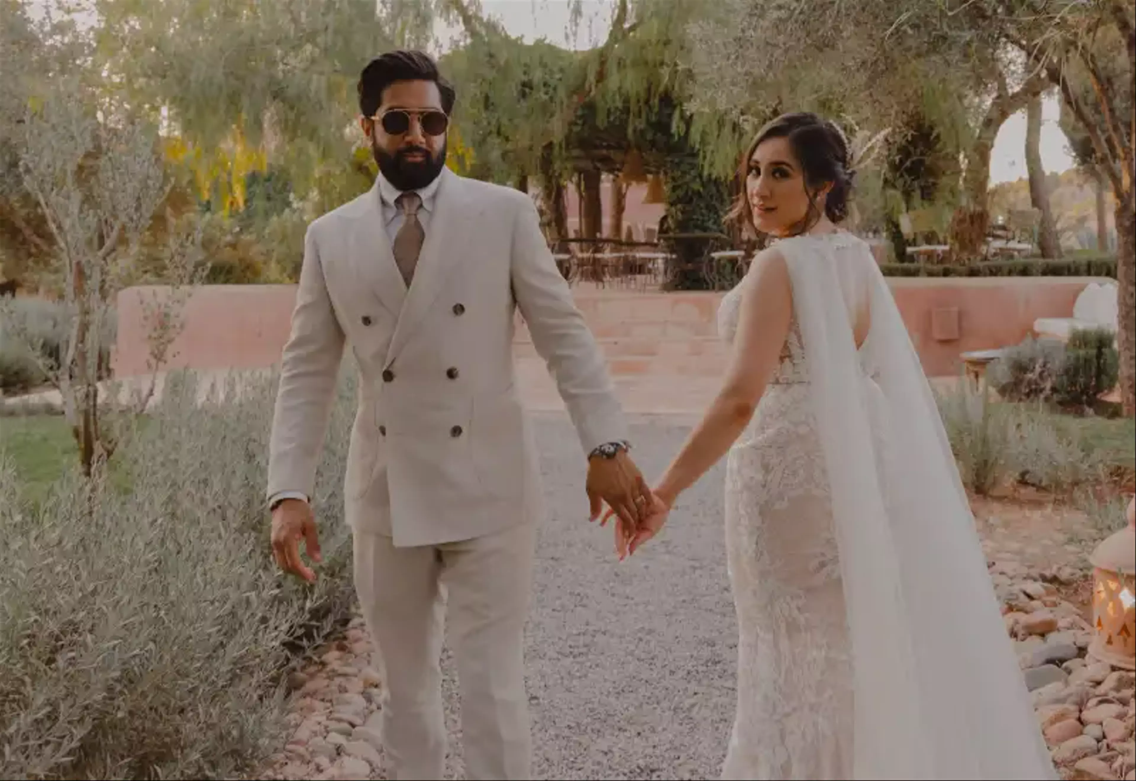 Bride and groom holding hands