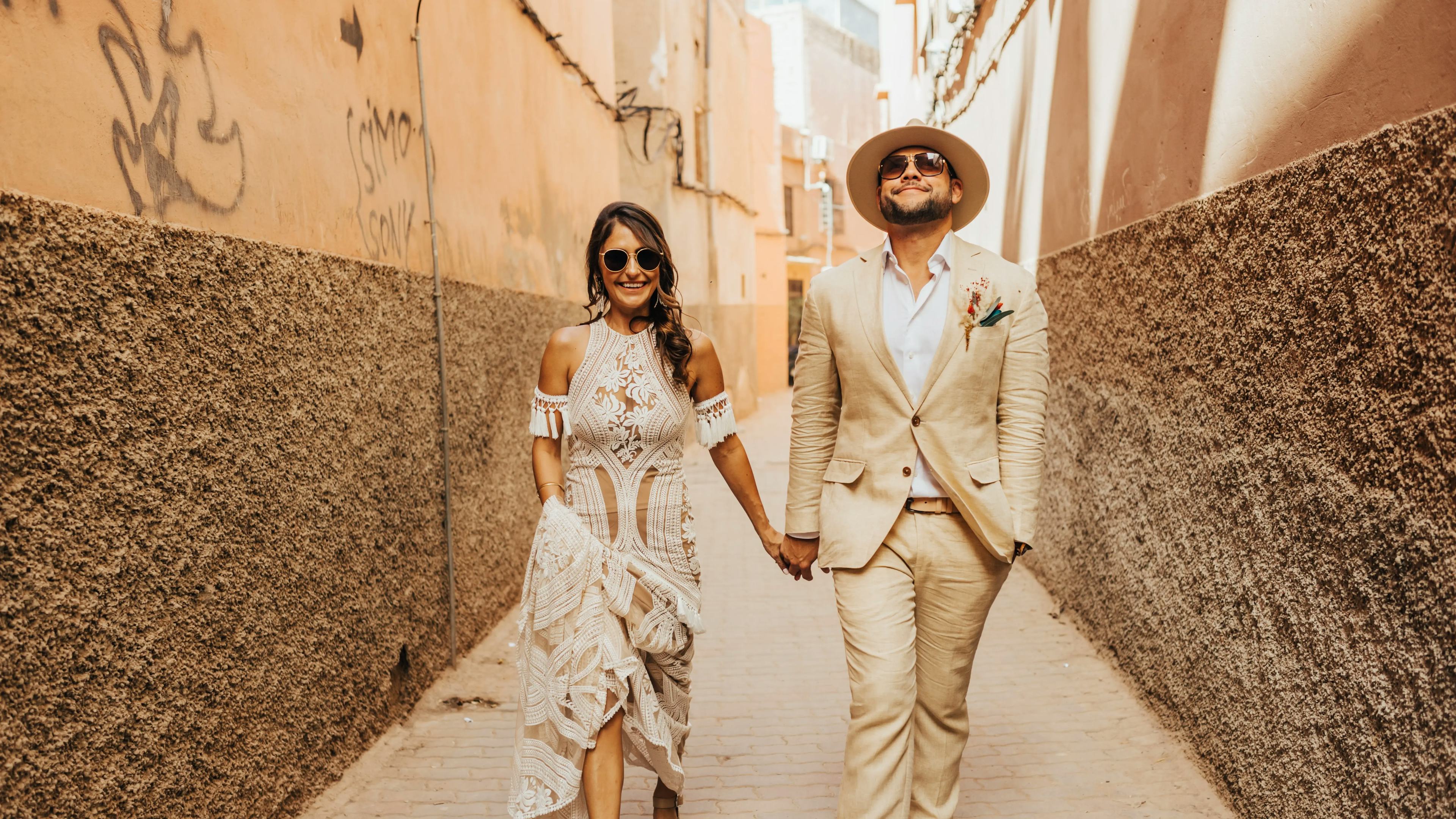 Wedding couple walking through Marrakech