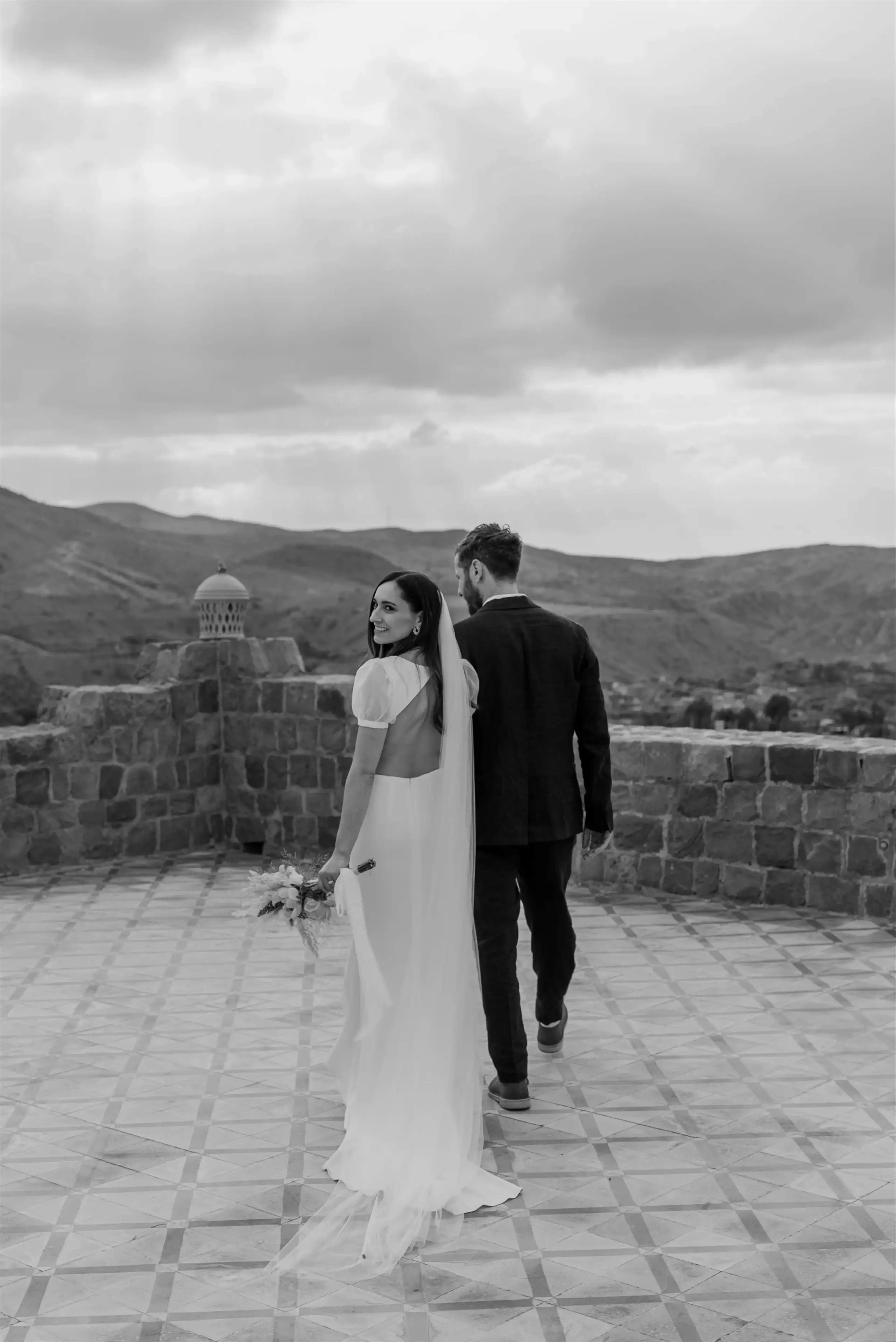 hoto shoot of brides on a black and white roof