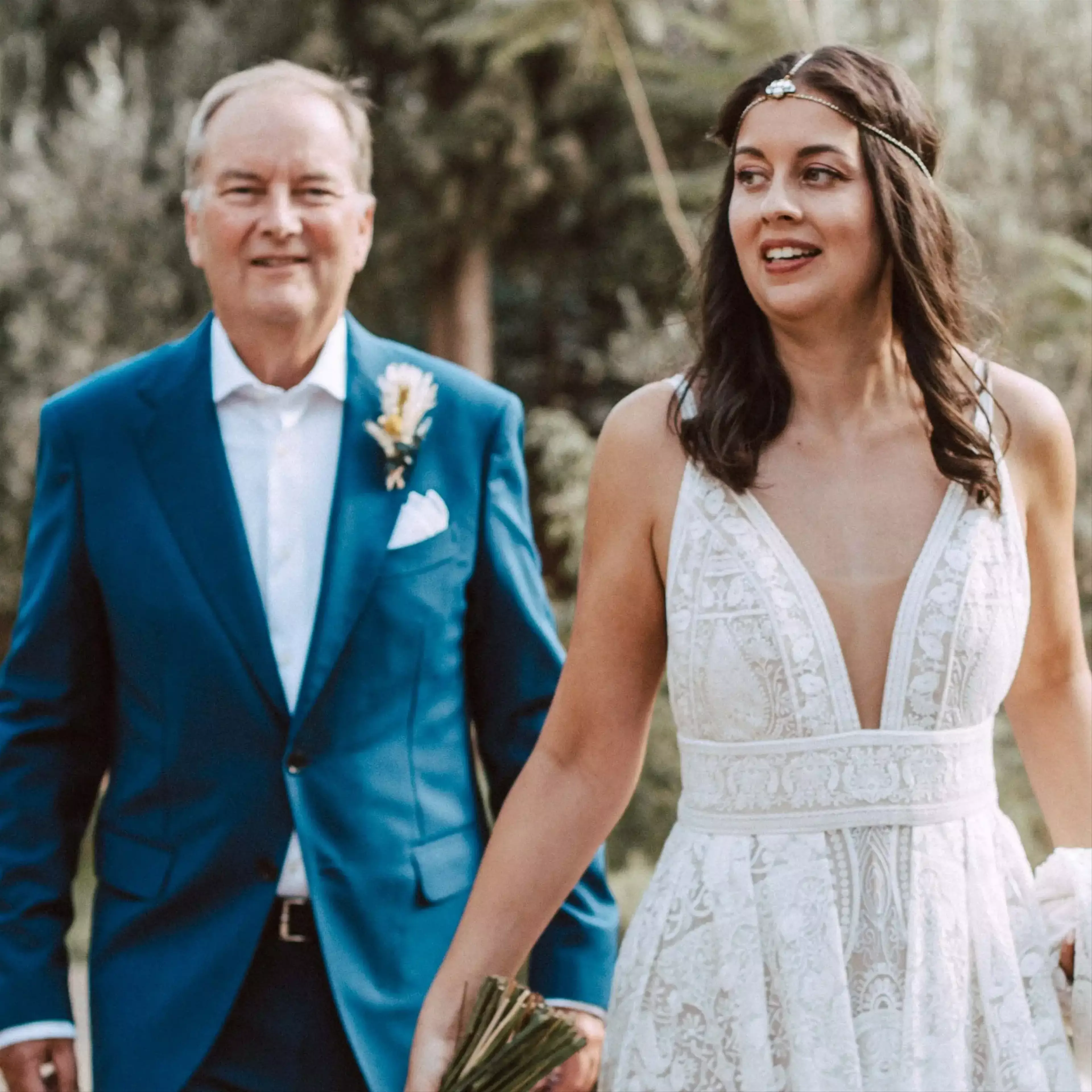 Bride and father walking down aisle 