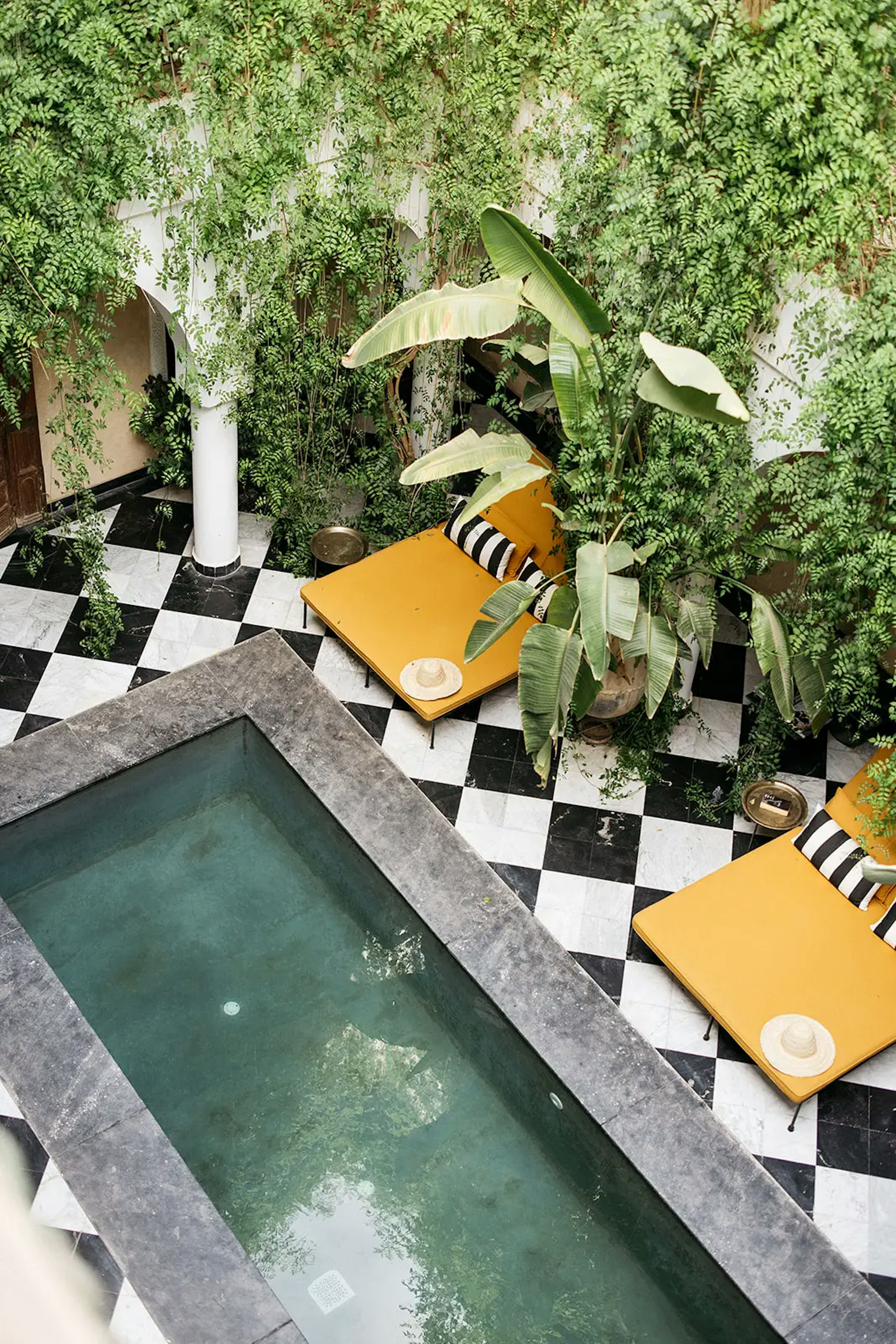 Swimming pool of the villa with its emblematic yellow armchair