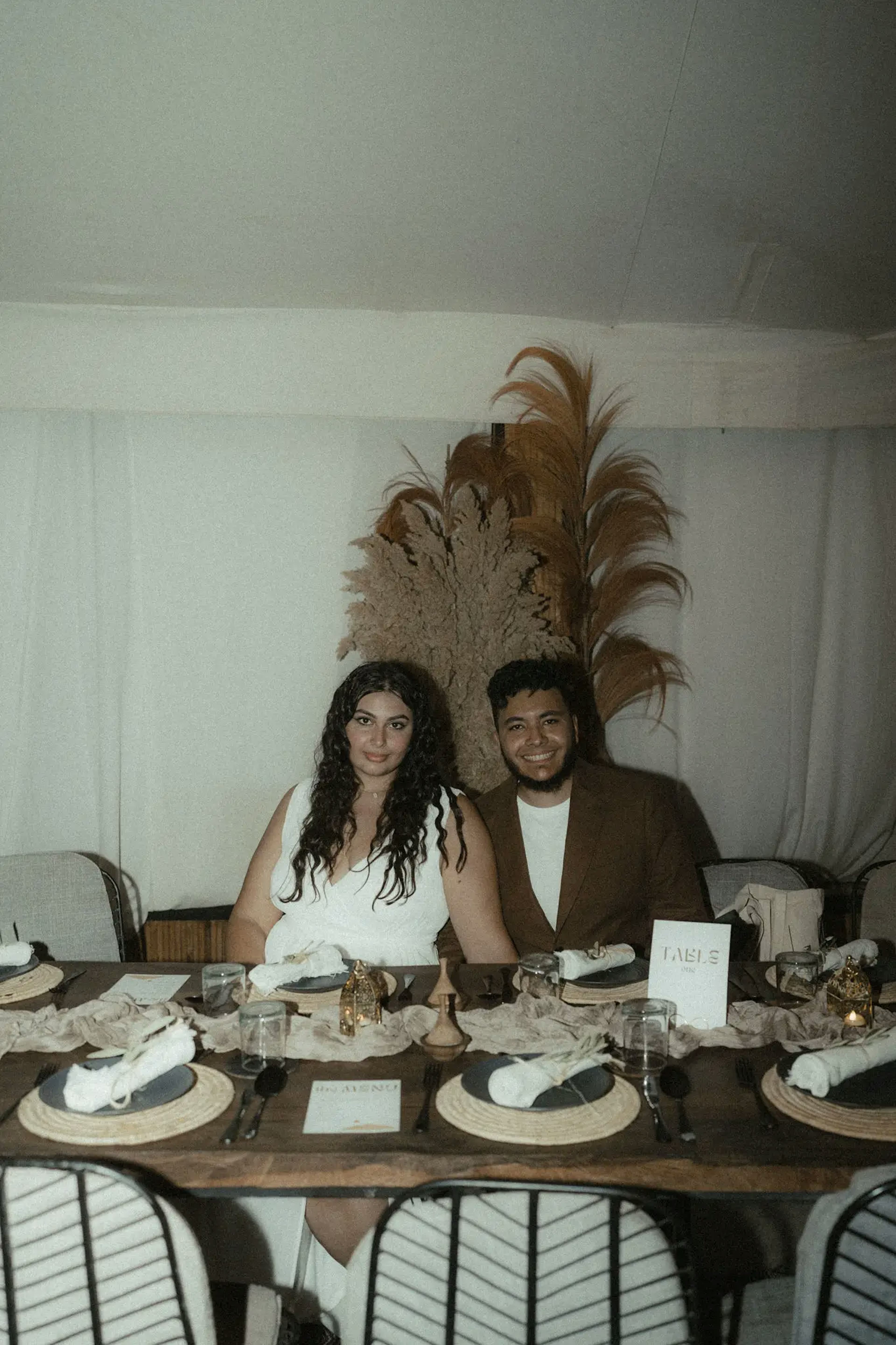 The spouses sit at the table for dinner 