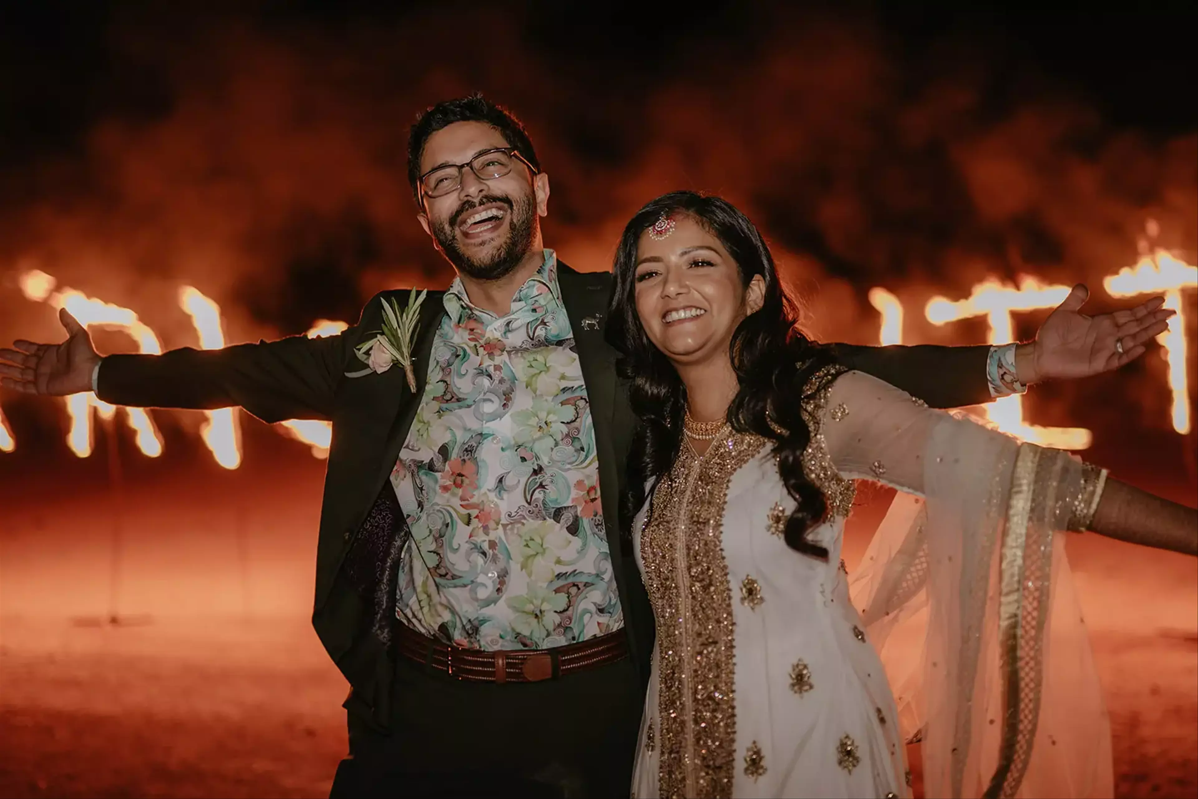 Couple in front of fireworks